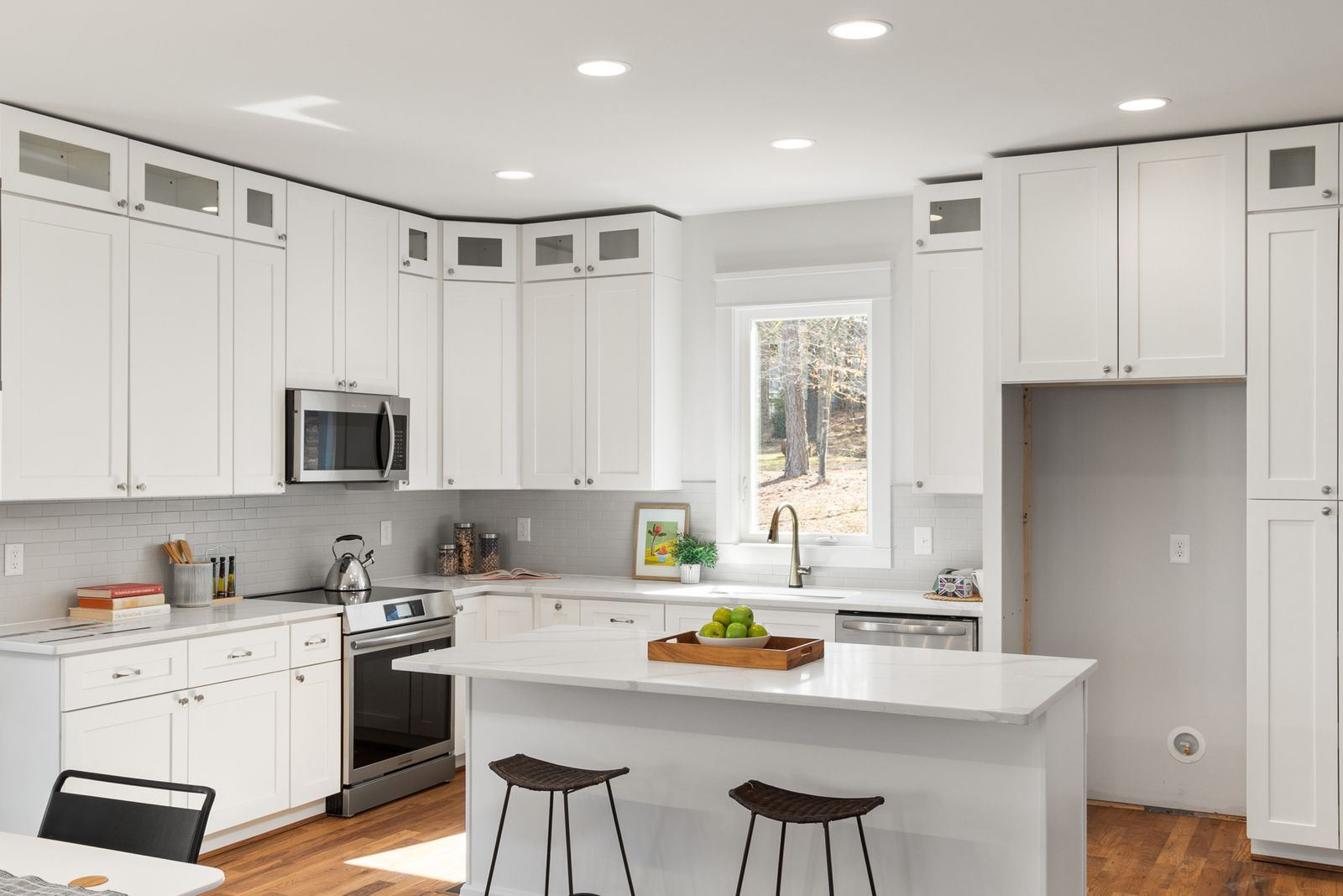 Bright modern white kitchen with island