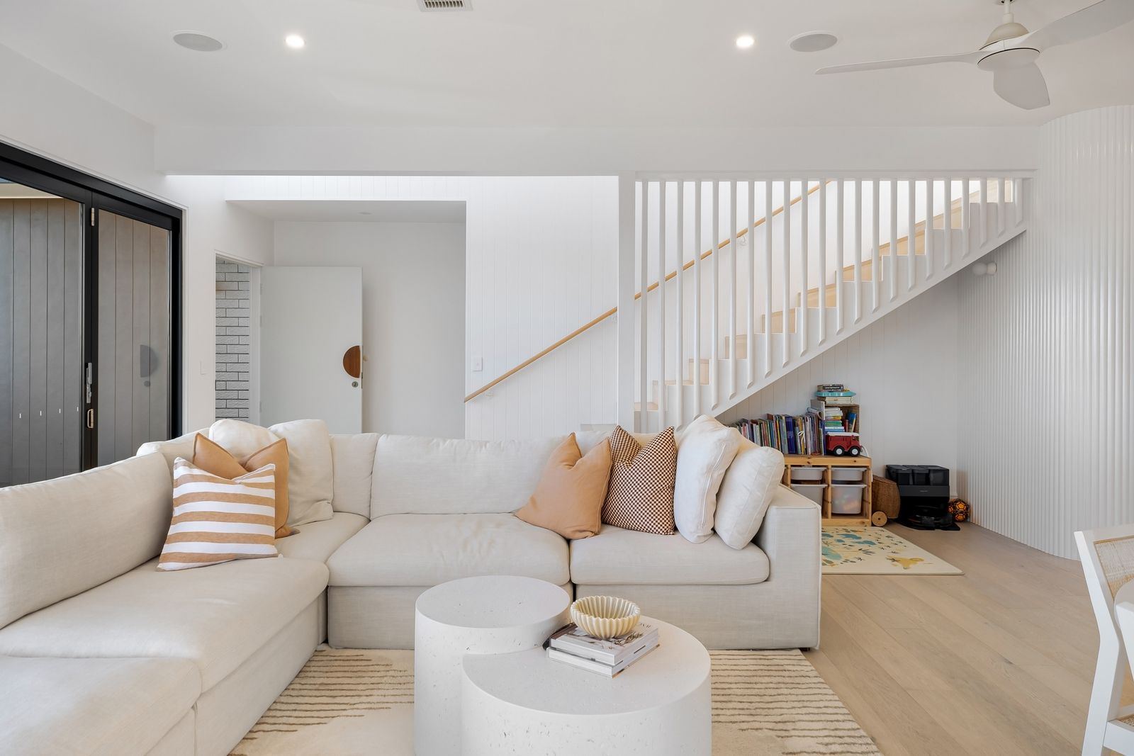 Bright modern living room with white sofa